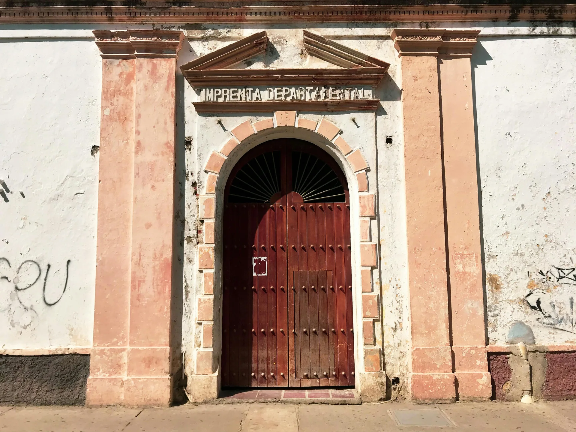 Charming colonial doorway on a sunny street in Cartagena, Colombia