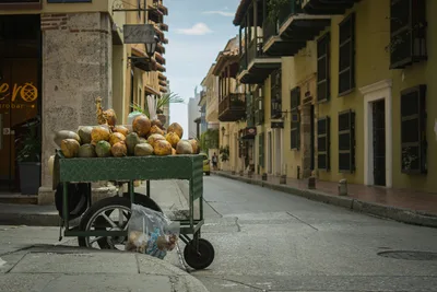Coconut vendor cart in the colonial streets of Cartagena, Colombia.