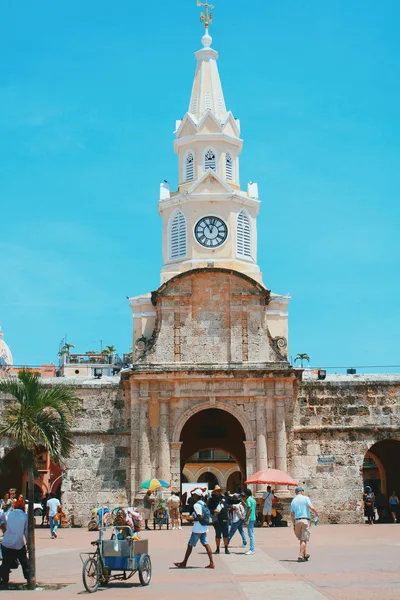 View of the iconic Clock Tower in Cartagena's old town, a vibrant tourist destination.